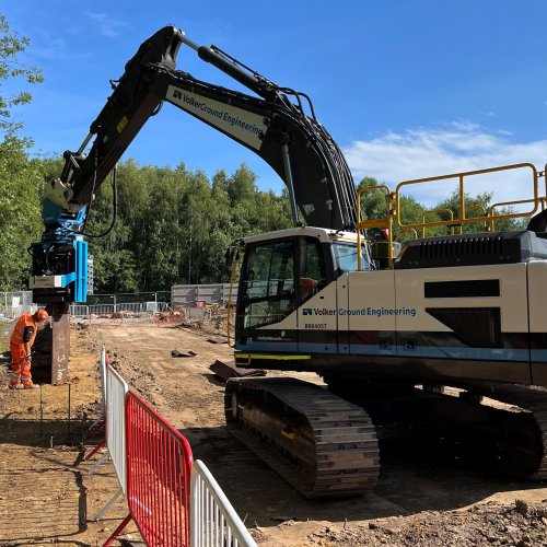 A movax driving piles into an embankment 