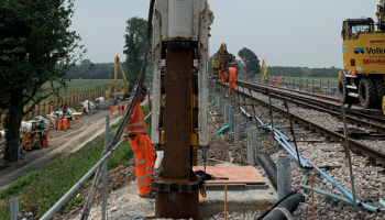 Picture of a hammer being driven into the ground.