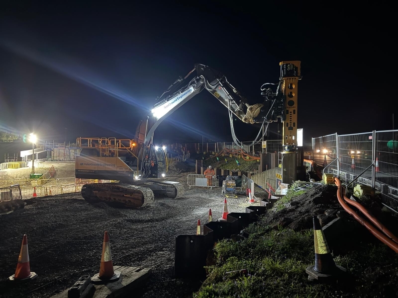 piling machine on construction site at night