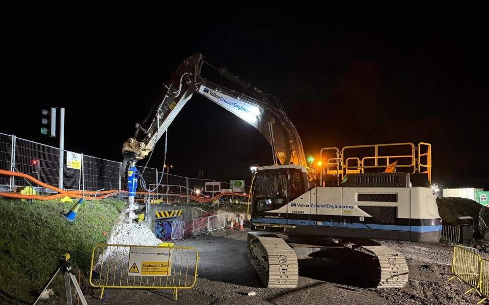 piling machine on construction site at night