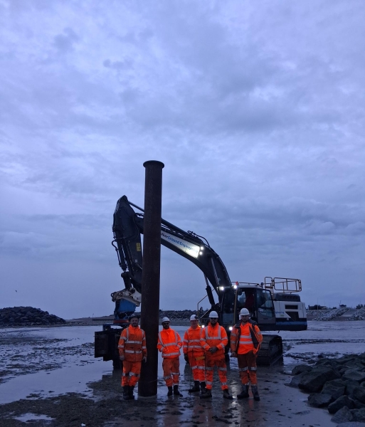 Men stood around a rig.