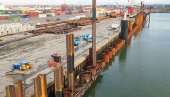 Piling rig on the water edge, piling into the sea