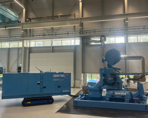 Large two piece piling machine in blue
