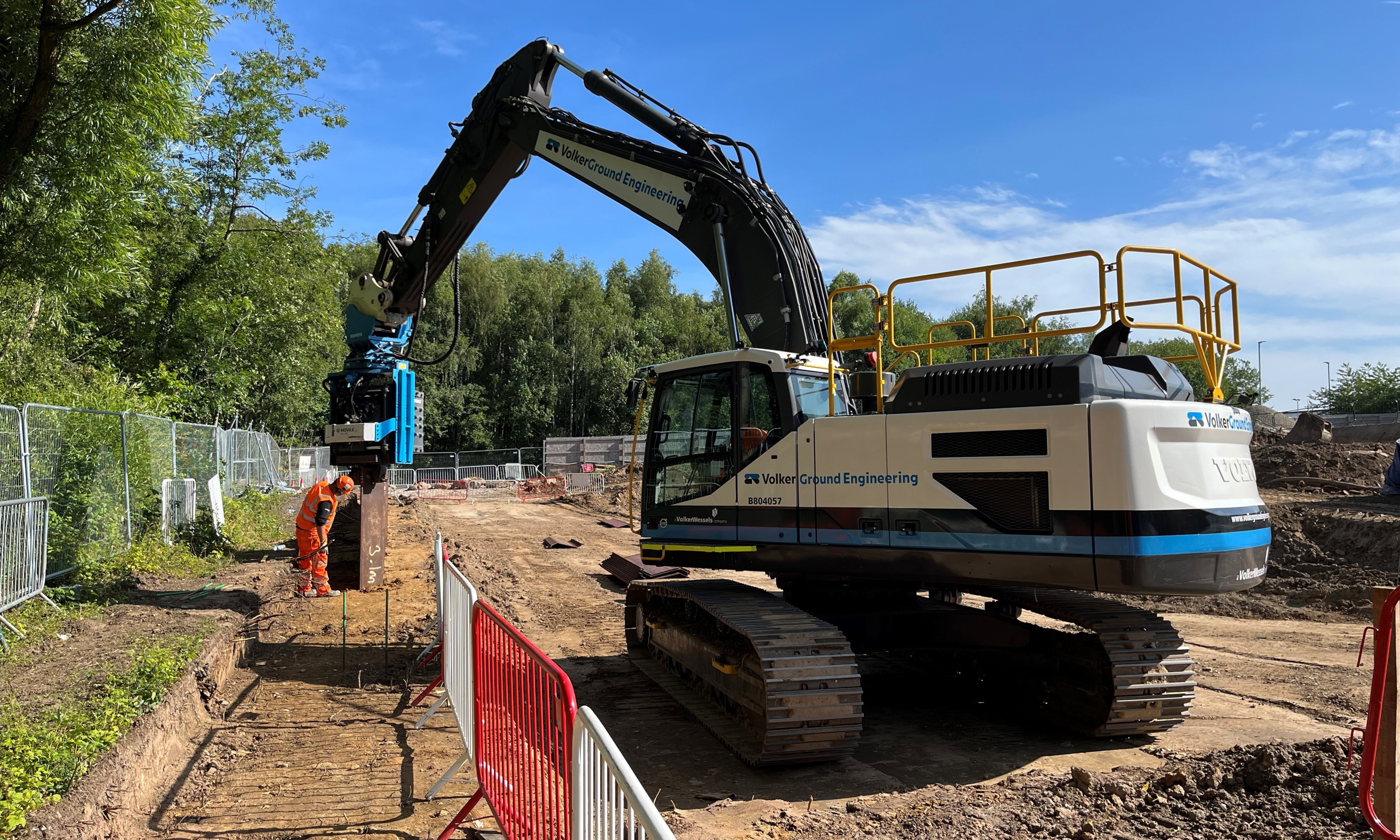 A movax driving piles into an embankment 